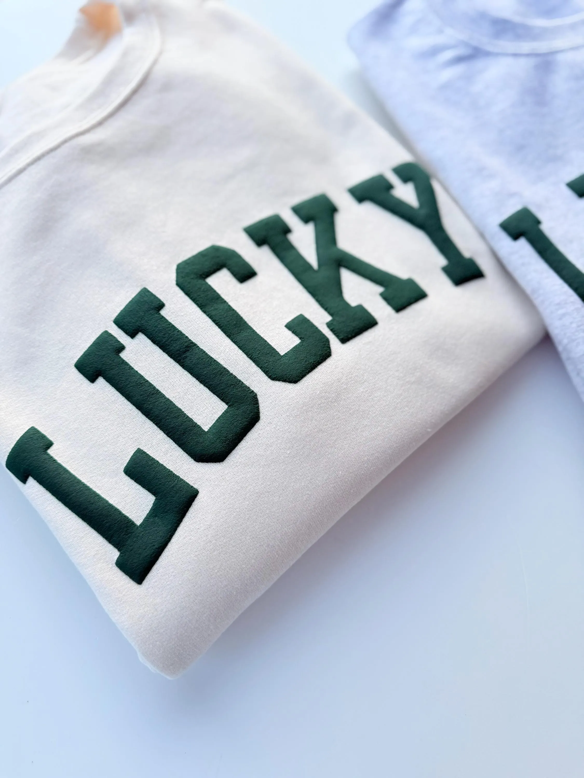 Embossed Lucky Varsity Sweatshirt